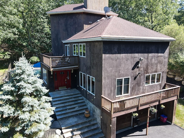 36 Ridgetop Dr, Tomkins Cove, NY 10986 - rear view of property with roof with shingles, a balcony, and a chimney