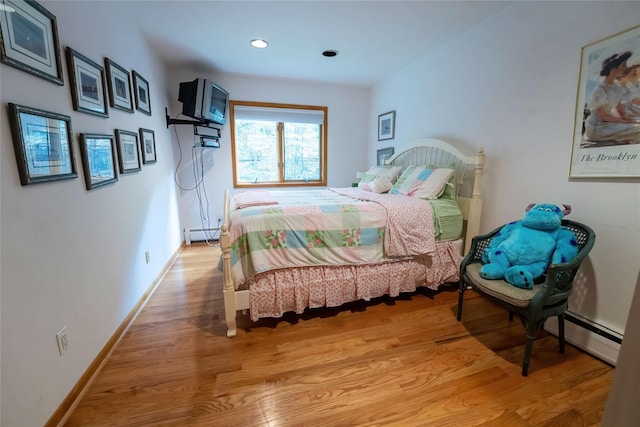 36 Ridgetop Dr, Tomkins Cove, NY 10986 - bedroom featuring baseboard heating, light wood finished floors, a baseboard radiator, baseboards, and recessed lighting