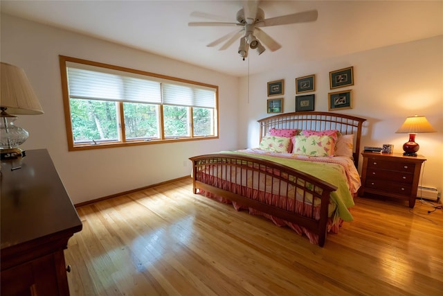 36 Ridgetop Dr, Tomkins Cove, NY 10986 - bedroom featuring wood finished floors, baseboards, a baseboard heating unit, and ceiling fan