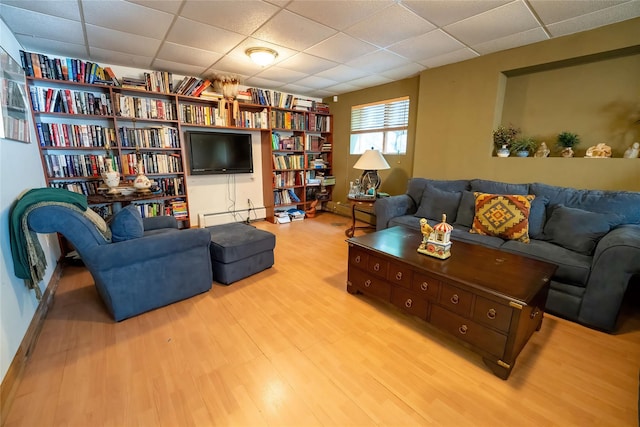 36 Ridgetop Dr, Tomkins Cove, NY 10986 - living room featuring a drop ceiling, wood finished floors, and baseboard heating