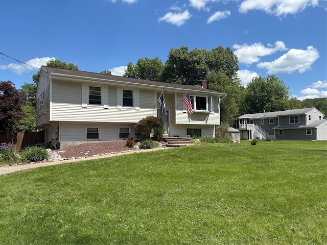 56 Martin Dr, Wappingers Falls, NY 12590 - raised ranch with a chimney and a front lawn