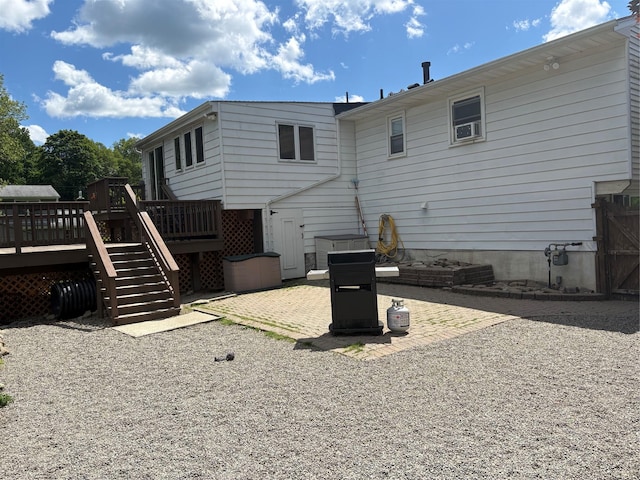 56 Martin Dr, Wappingers Falls, NY 12590 - back of house with stairway, a deck, and a patio area