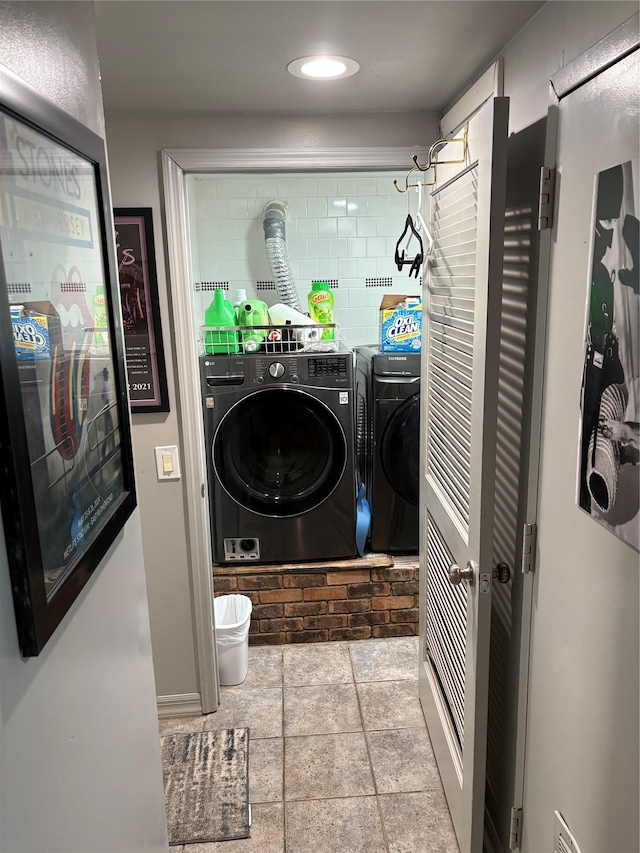 56 Martin Dr, Wappingers Falls, NY 12590 - laundry room with washing machine and dryer, recessed lighting, and stone finish floors