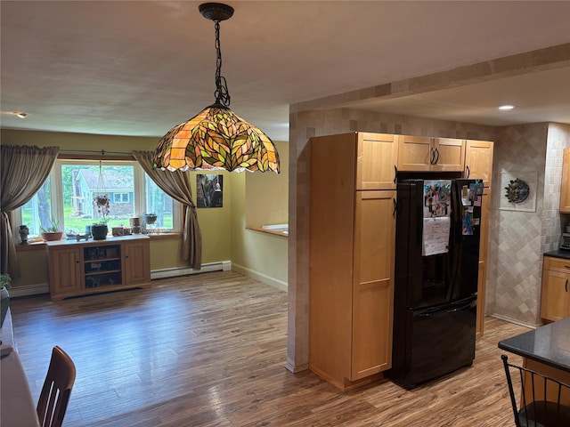 56 Martin Dr, Wappingers Falls, NY 12590 - kitchen featuring freestanding refrigerator, baseboards, wood finished floors, and a baseboard radiator