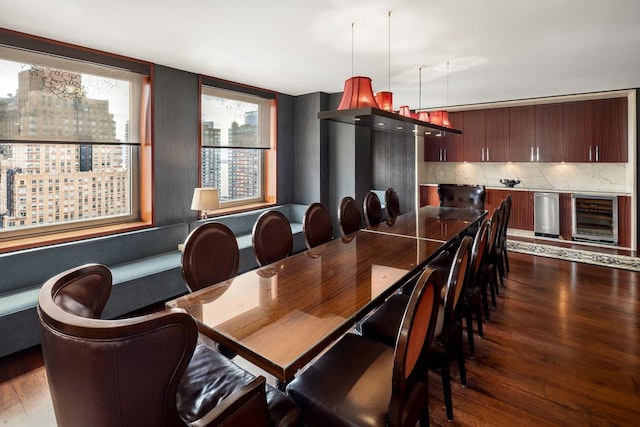 dining room with wood finished floors and wine cooler