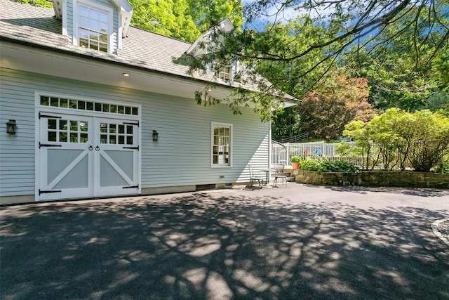back of house featuring fence