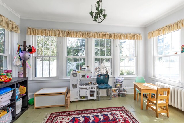 interior space featuring radiator heating unit, a healthy amount of sunlight, and tile patterned flooring
