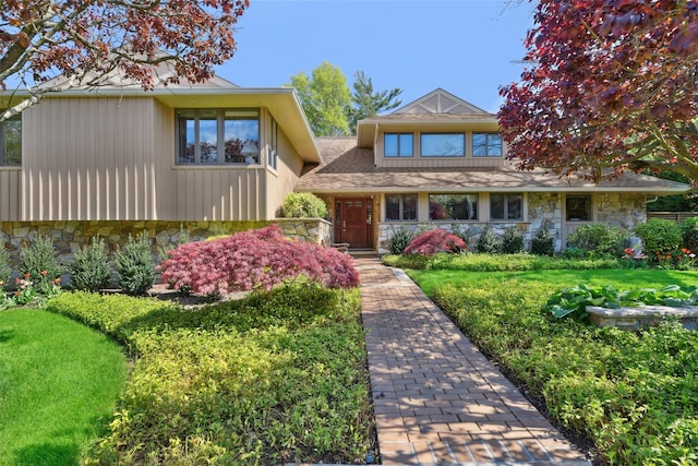 1325 Huckleberry Ln, Hewlett Harbor, NY 11557 - view of front of home with stone siding and a front yard