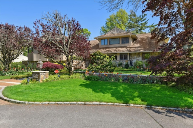 1325 Huckleberry Ln, Hewlett Harbor, NY 11557 - view of front of property with stone siding and a front yard