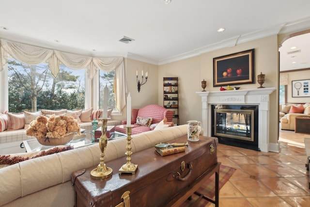 1325 Huckleberry Ln, Hewlett Harbor, NY 11557 - living area with crown molding, a glass covered fireplace, light tile patterned floors, and recessed lighting