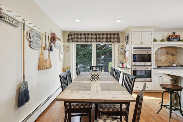 1325 Huckleberry Ln, Hewlett Harbor, NY 11557 - dining area with a baseboard radiator, light wood-style flooring, and recessed lighting
