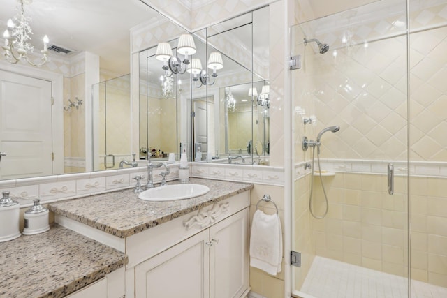 1325 Huckleberry Ln, Hewlett Harbor, NY 11557 - bathroom featuring a chandelier, a stall shower, and vanity
