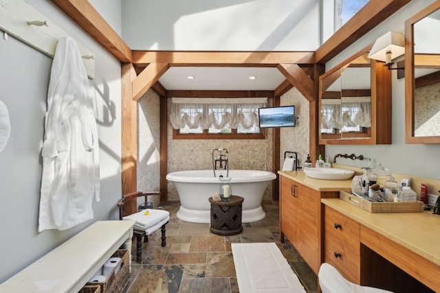 1325 Huckleberry Ln, Hewlett Harbor, NY 11557 - bathroom featuring stone tile flooring, a freestanding tub, and vanity