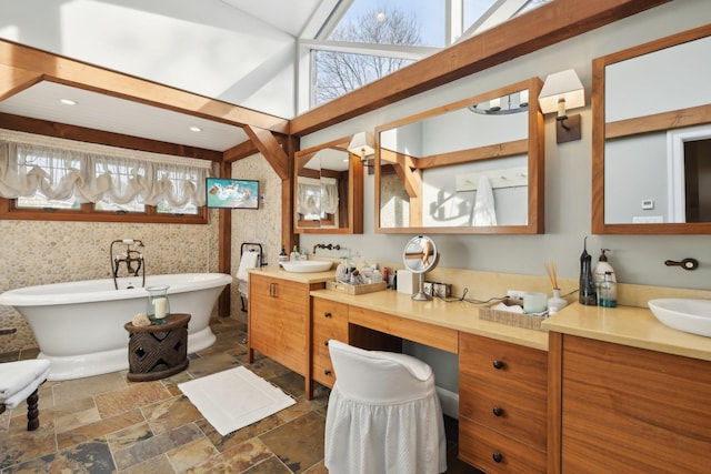 1325 Huckleberry Ln, Hewlett Harbor, NY 11557 - bathroom featuring a freestanding bath, stone finish floors, and vanity