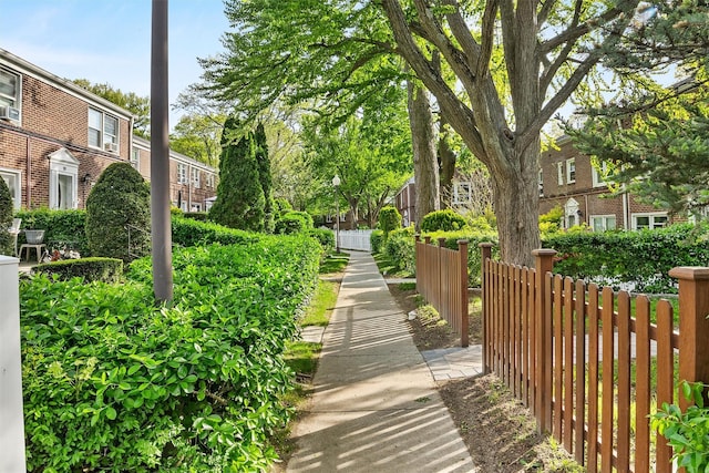 view of community featuring fence
