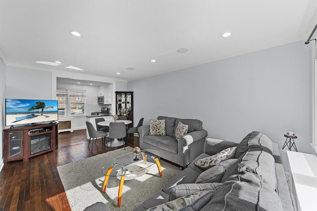 living area featuring recessed lighting, radiator, crown molding, and dark wood finished floors