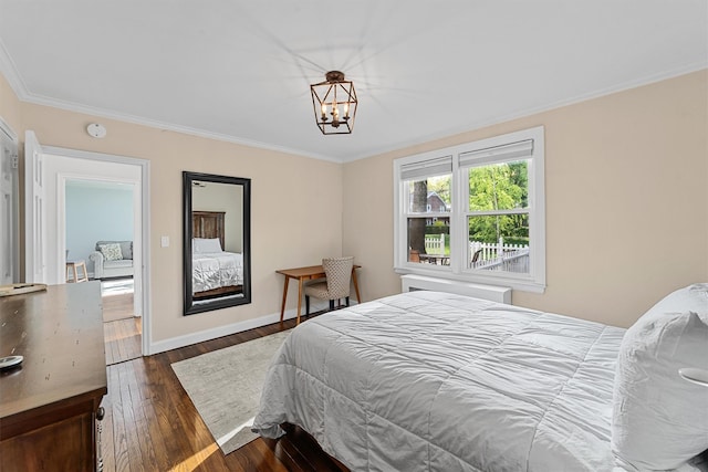 bedroom featuring baseboards, an inviting chandelier, ornamental molding, and dark wood finished floors
