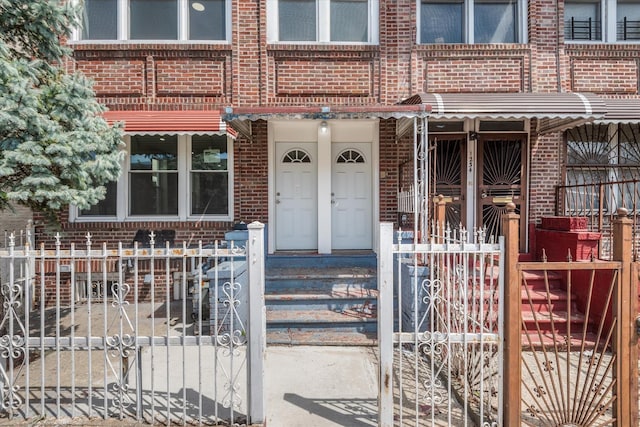 1236 Evergreen Ave, Bronx, NY 10472 - property entrance with brick siding and fence