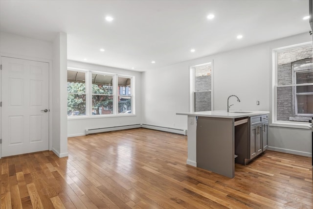 1236 Evergreen Ave, Bronx, NY 10472 - kitchen featuring a sink, light countertops, wood-type flooring, healthy amount of natural light, and recessed lighting