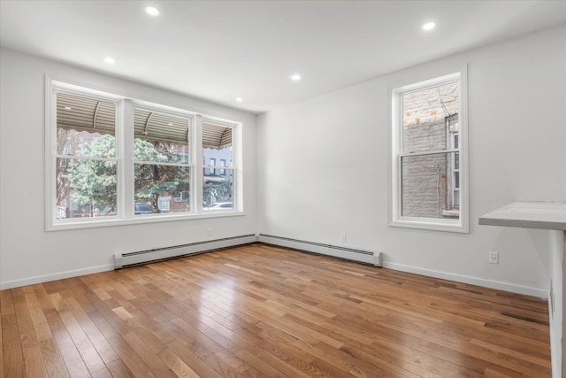 1236 Evergreen Ave, Bronx, NY 10472 - spare room with hardwood / wood-style floors, a baseboard radiator, recessed lighting, and baseboards