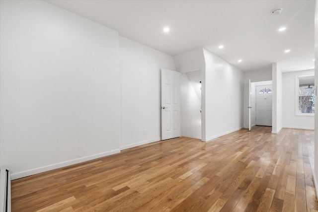 1236 Evergreen Ave, Bronx, NY 10472 - empty room with light wood-style floors, baseboards, recessed lighting, and a smoke detector