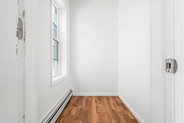 1236 Evergreen Ave, Bronx, NY 10472 - unfurnished room with light wood finished floors, a baseboard heating unit, and baseboards
