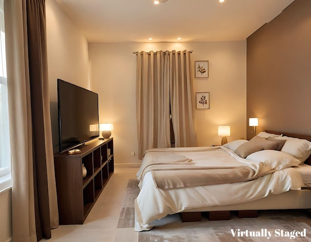 bedroom featuring recessed lighting and light wood-style floors