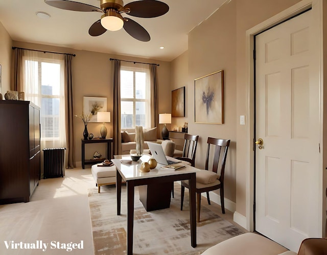 sitting room with baseboards and a ceiling fan