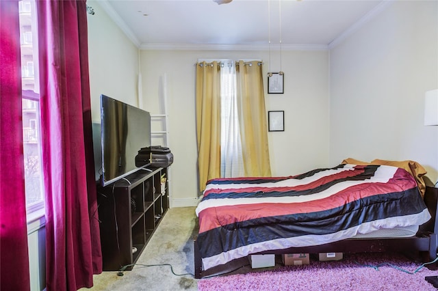 bedroom with baseboards, ornamental molding, and carpet flooring