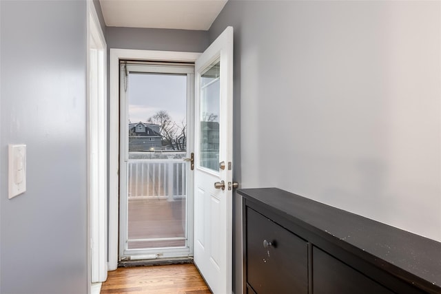 doorway to outside featuring light wood finished floors