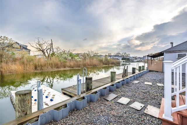 dock area with a water view