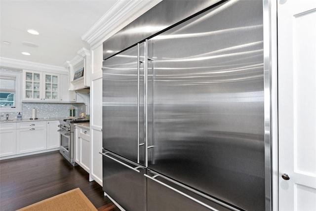 879 Oceanfront, Long Beach, NY 11561 - kitchen with high end appliances, glass insert cabinets, white cabinets, decorative backsplash, and dark wood-type flooring