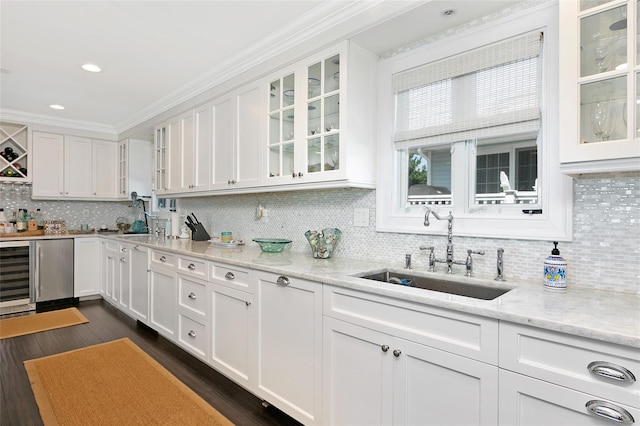 879 Oceanfront, Long Beach, NY 11561 - kitchen with a sink, white cabinets, decorative backsplash, ornamental molding, and recessed lighting