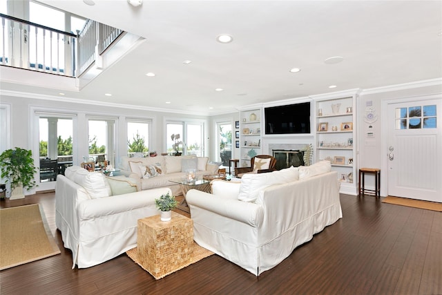 879 Oceanfront, Long Beach, NY 11561 - living room featuring ornamental molding, recessed lighting, a glass covered fireplace, and dark wood finished floors