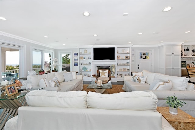879 Oceanfront, Long Beach, NY 11561 - living room with a premium fireplace, ornamental molding, recessed lighting, and wood finished floors