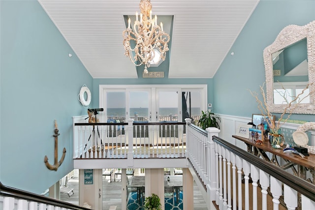 879 Oceanfront, Long Beach, NY 11561 - hall with a chandelier, wainscoting, plenty of natural light, and lofted ceiling