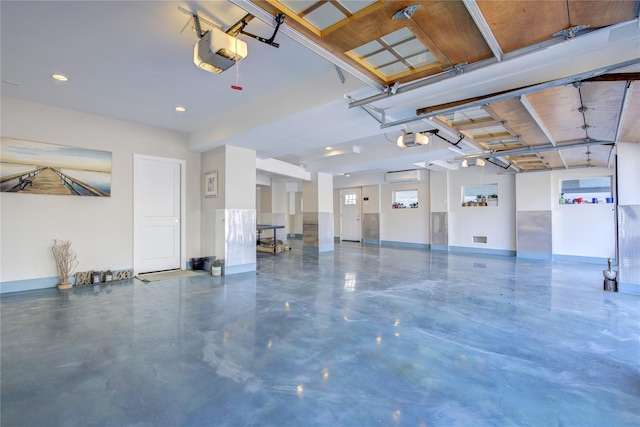 879 Oceanfront, Long Beach, NY 11561 - garage with a garage door opener, recessed lighting, baseboards, and an AC wall unit