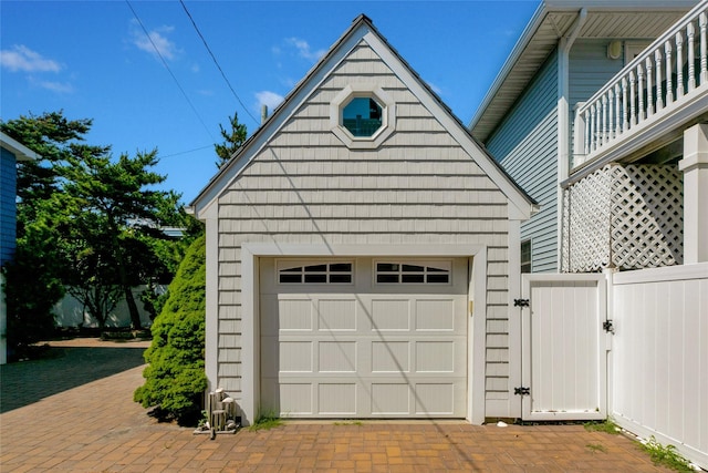 879 Oceanfront, Long Beach, NY 11561 - garage featuring a gate and fence