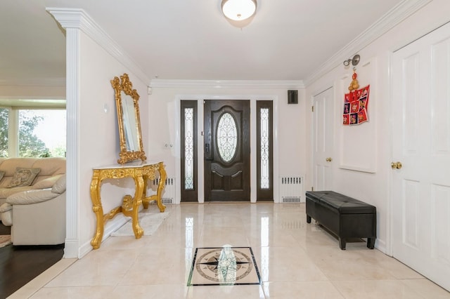 165 Tara Dr, Roslyn, NY 11576 - foyer with radiator, crown molding, and baseboards