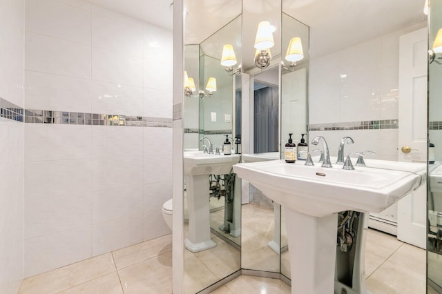165 Tara Dr, Roslyn, NY 11576 - bathroom featuring tile walls, tile patterned floors, a chandelier, and toilet
