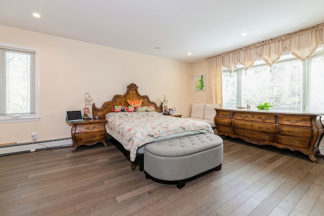 165 Tara Dr, Roslyn, NY 11576 - bedroom featuring wood finished floors, recessed lighting, and baseboard heating