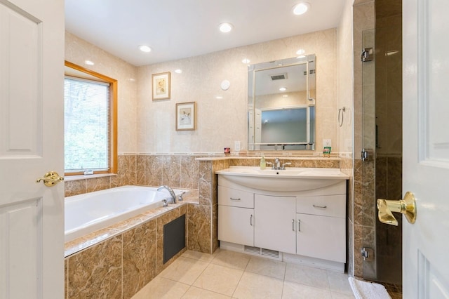 165 Tara Dr, Roslyn, NY 11576 - full bath with tile patterned flooring, a stall shower, vanity, a bath, and recessed lighting