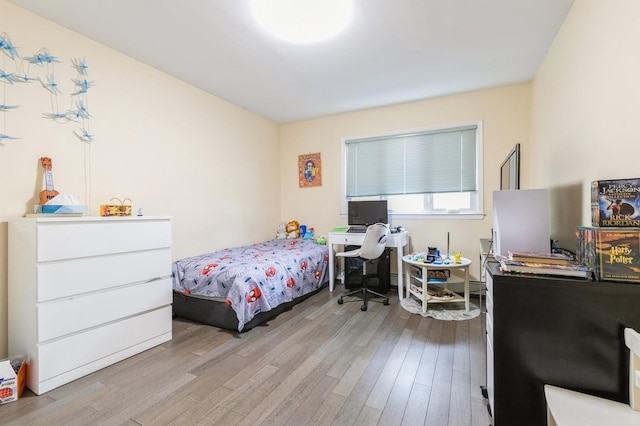 165 Tara Dr, Roslyn, NY 11576 - bedroom with wood finished floors and a desk