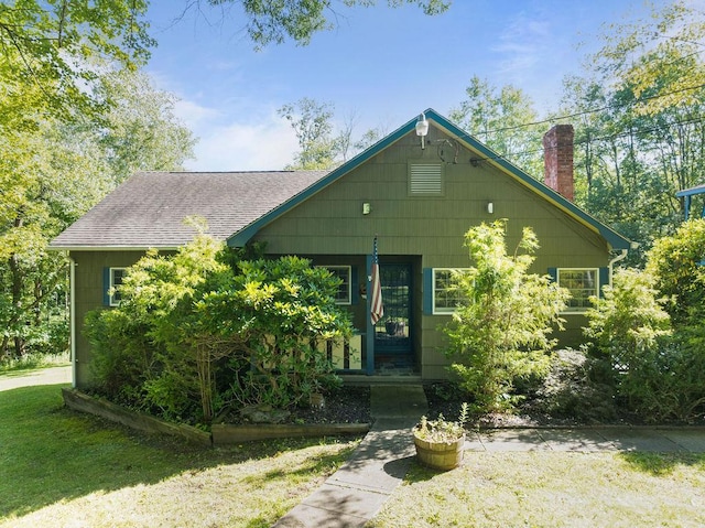 51 Strong Rd, Ferndale, NY 12734 - view of front of property with a chimney, roof with shingles, and a front lawn