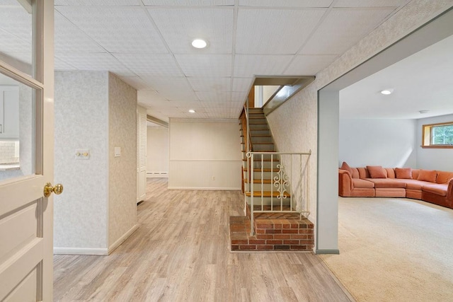 51 Strong Rd, Ferndale, NY 12734 - below grade area featuring stairway, baseboards, wallpapered walls, and wood finished floors