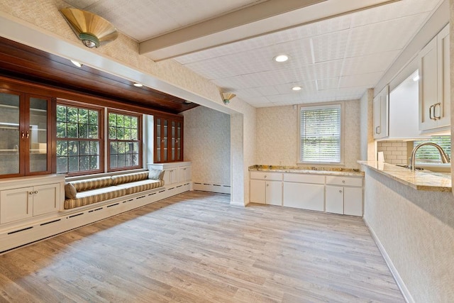 51 Strong Rd, Ferndale, NY 12734 - unfurnished living room with baseboards, a baseboard radiator, light wood finished floors, and a sink