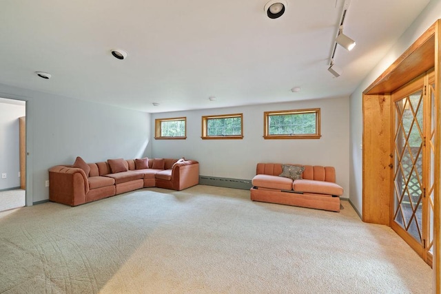 51 Strong Rd, Ferndale, NY 12734 - carpeted living area with track lighting and a baseboard heating unit