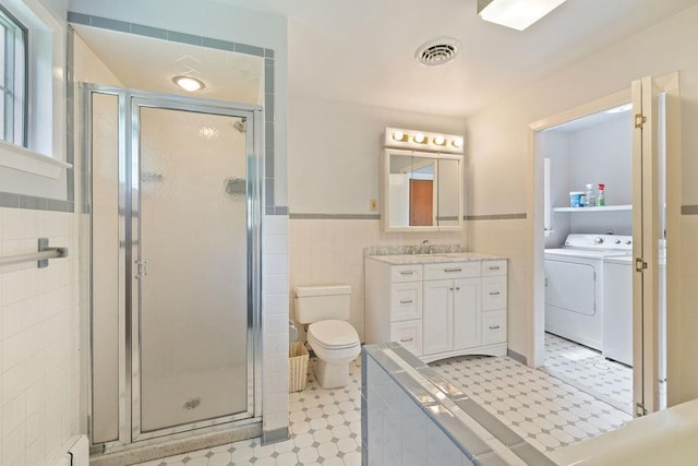 51 Strong Rd, Ferndale, NY 12734 - full bathroom with visible vents, tile walls, a shower stall, tile patterned floors, and toilet