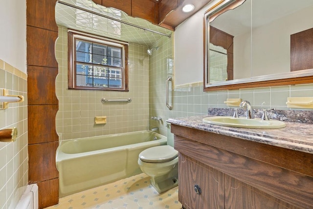 51 Strong Rd, Ferndale, NY 12734 - bathroom with vanity, tub / shower combination, toilet, tile walls, and a baseboard heating unit