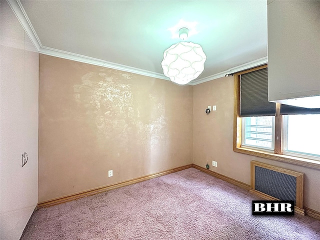 spare room featuring baseboards, radiator heating unit, ornamental molding, and carpet flooring